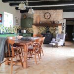 a picture of a kitchen with large fireplace